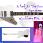 paul stanley signature guitar review.- Image of Artist and his guitar in white