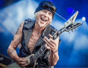 Michael Schenker Flying V-image of MS Playing guitar live on stage