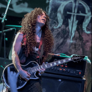 Marty Friedman Signature Guitar -Feature Image with MF Playing Guitar and the image Marty Fieldman playing his Jackson guitar live on stage