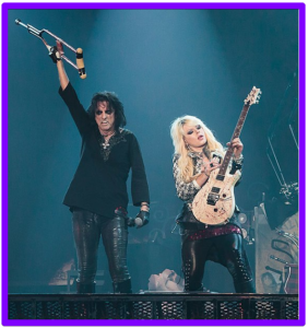 Orianthi Signature Guitar-An image of artist onstage playing guitar live with Alice Cooper