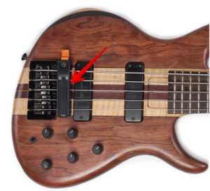 guitar string dampener-Image of a bridge dampener on a bass guitar