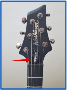 guitar string dampener-Image of a headstock of guitar