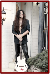 yngwie malmsteen signature guitar- Image of YM with his Ovation Viper Nylon String Gutiar 