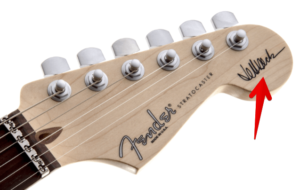 jeff beck signature Stratocaster-Image of the Version 2 signature guitar Head stock with signature 