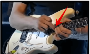 jeff beck's guitar style-Image of Beck using a two hand tapping technique