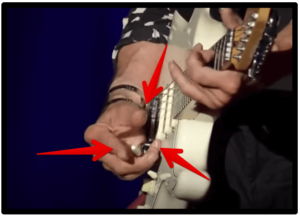 jeff beck's guitar style-Image of Beck right hand showing off some of his technique.