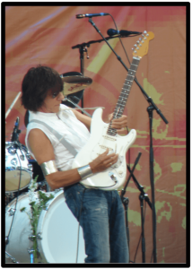jeff beck's guitar style-Image of Artist playing live with his white signature strat jeff beck's guitar style-Image of Artist playing live with his white signature strat