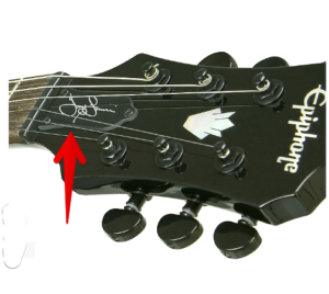 Epiphone Tony Iommi Signature G 400 -an image of the Guitar headstock with artist signature