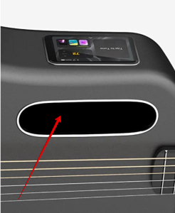 the lava me 3 smartguitar-Image of guitars sound hole where the controls are located.