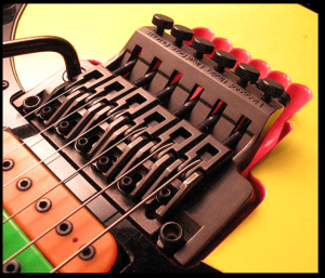 7 Ways To- Upgrade An Electric Guitar-Image of a Floyd Rose Tuning Bridge Setup