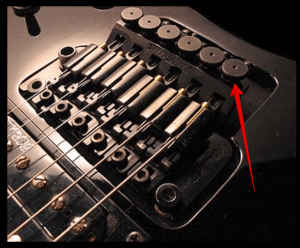 7 Ways To- Upgrade An Electric Guitar-Image of a Floyd Rose Bridge highlighting Tuners