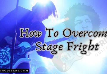 how to overcome stage fright with- and image of a guitarist onstage playing live