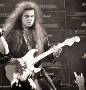 guitar popular- an image of the Yngwie Malmsteen playing live onstage