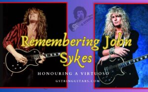 john sykes- The Feature image of the artist live on stage with his black guitar and standing with his black guitar