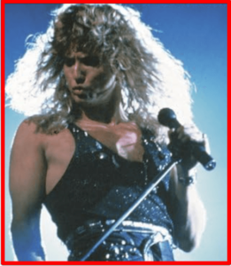 John Sykes-image of David Coverdale singing on stage