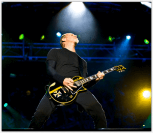 ESP Ltd James Hetfield Snakebyte - Image of JH playing live with his Signature Iron Cross ESP in Black and Yellow ESP Ltd James Hetfield Snakebyte - Image of JH playing live with his Signature Iron Cross ESP in Black and Yellow
