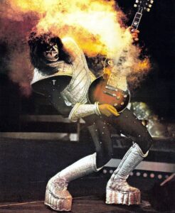 Remembering Ace Frehley - feature image of Ace as the spaceman with his smoking guitar 1977