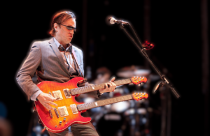 Baritone Electric Guitar - An Image of a Joe Bonamassa playing live in concert Baritone Electric Guitar - An Image of a Joe Bonamassa playing live in concert